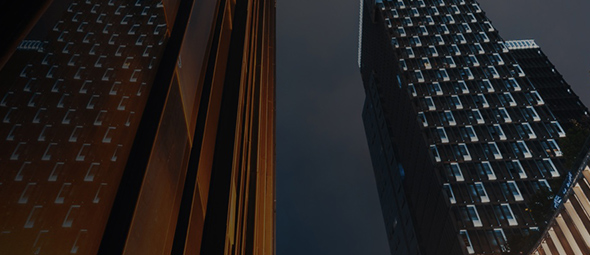 nighttime view of city skyscrapers